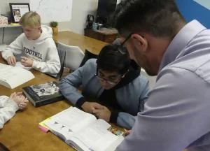 Student receiving one-on-one college prep tutoring to supplement public school education