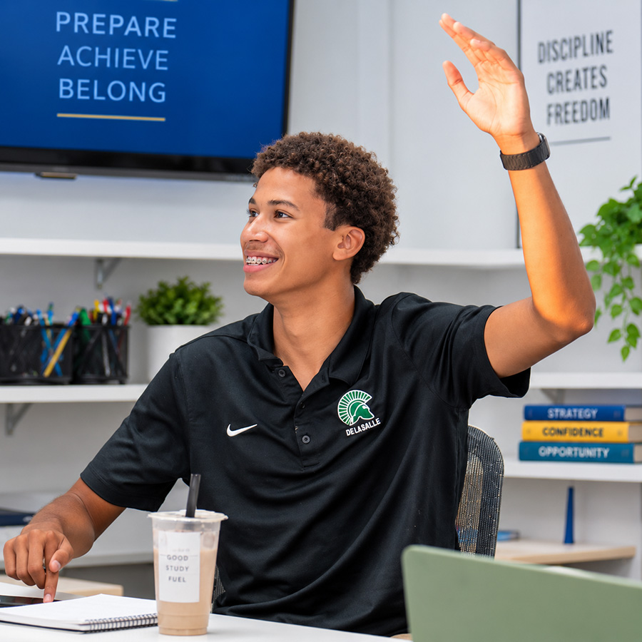 Olympus College Prep student raising hand